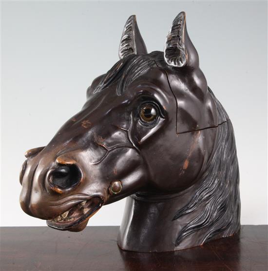 A 19th century Black Forest carved and painted wood horse head tobacco jar, height 11in.
